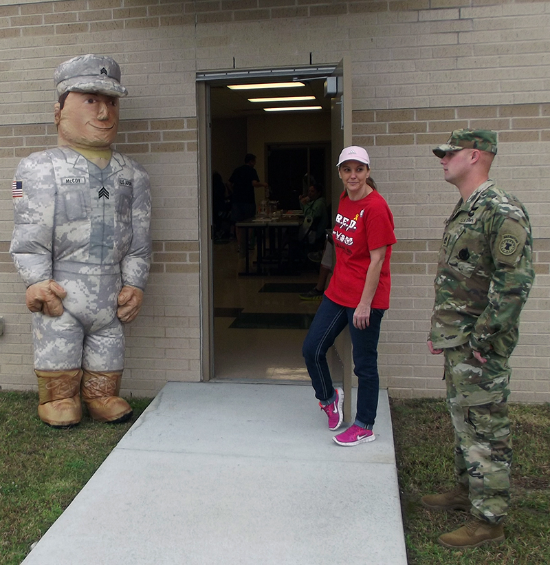 US Marine recruiter and volunteer Danielle stand guard