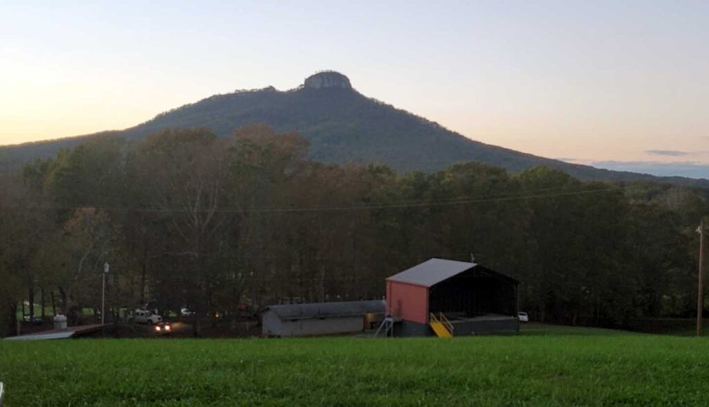 View of Pilot Mountain over farm house